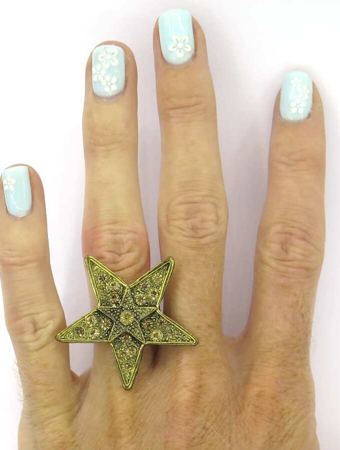 Ring ster goudkleurig stenen