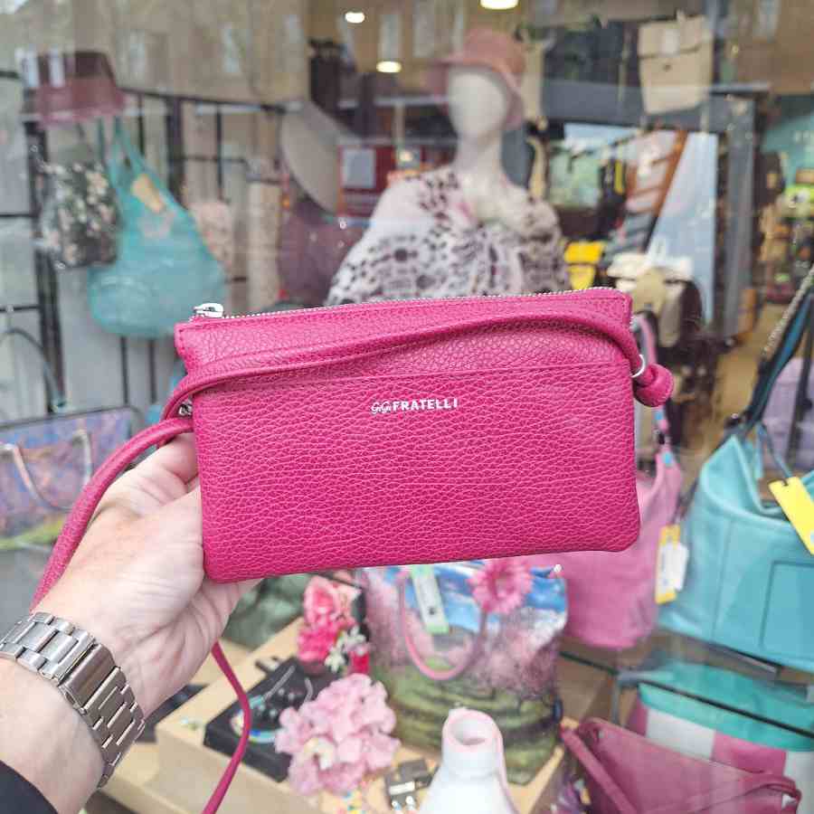 Roze leren clutch met lange schouderband Gigi