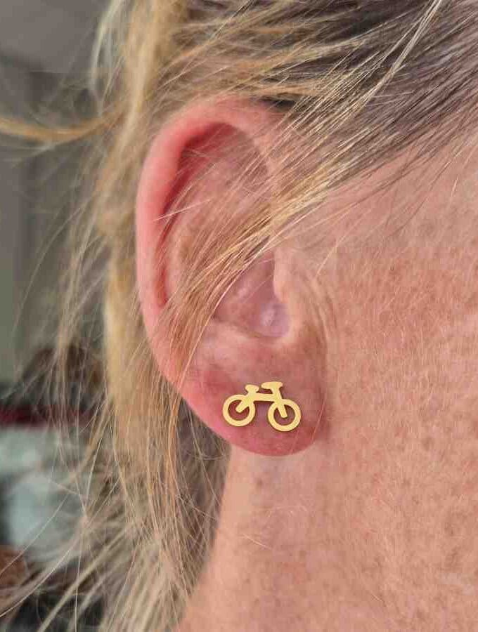 Oorsteker fiets in stainless steel goudkleur